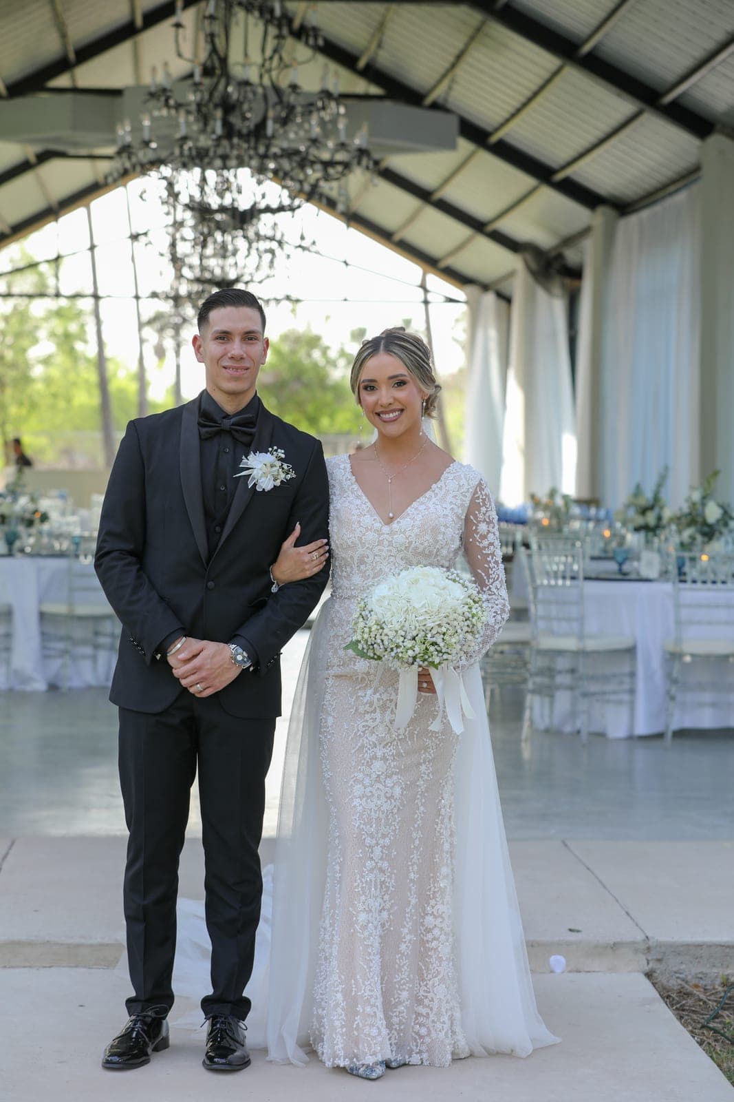 Newlyweds in a draped pavilion at an AB Event Productions wedding reception