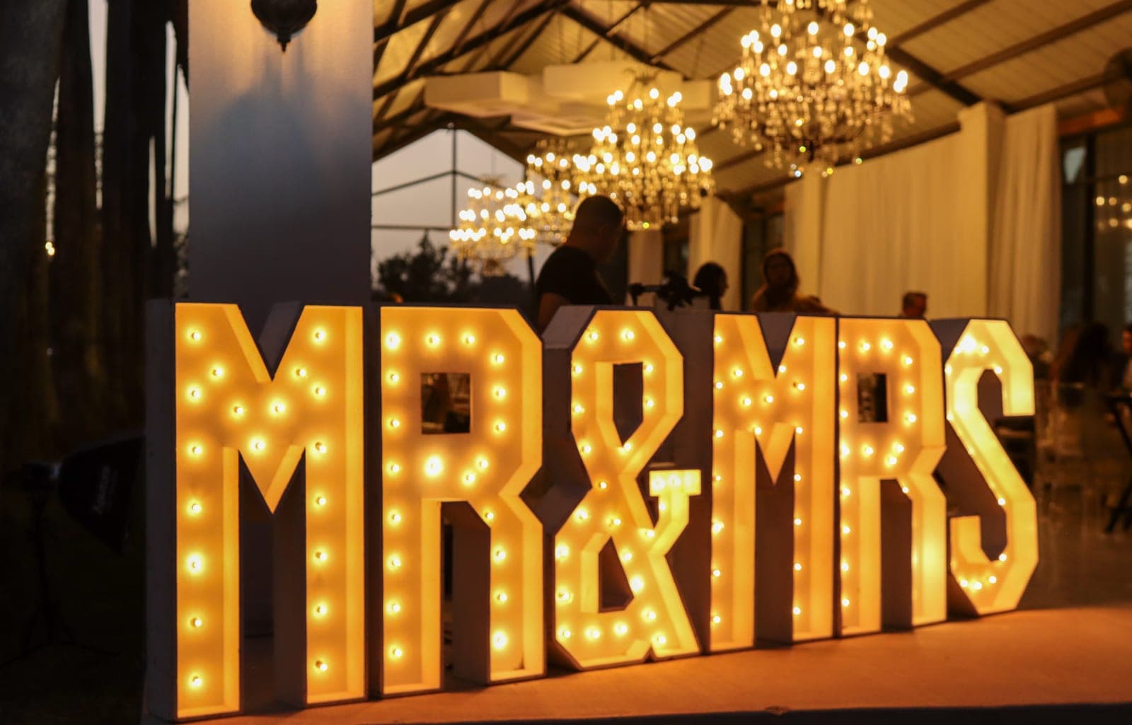 Illuminated MR & MRS marquee letters and chandeliers by AB Event Productions