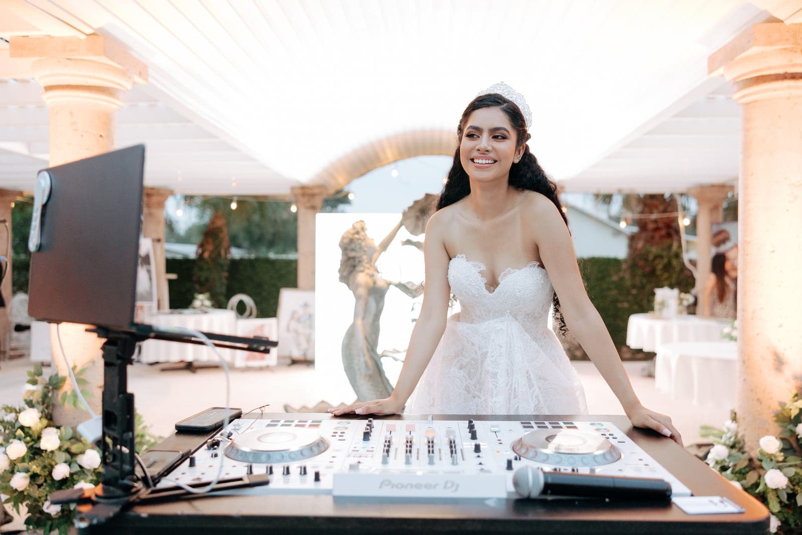 Bride behind the DJ booth at her AB Event Productions reception