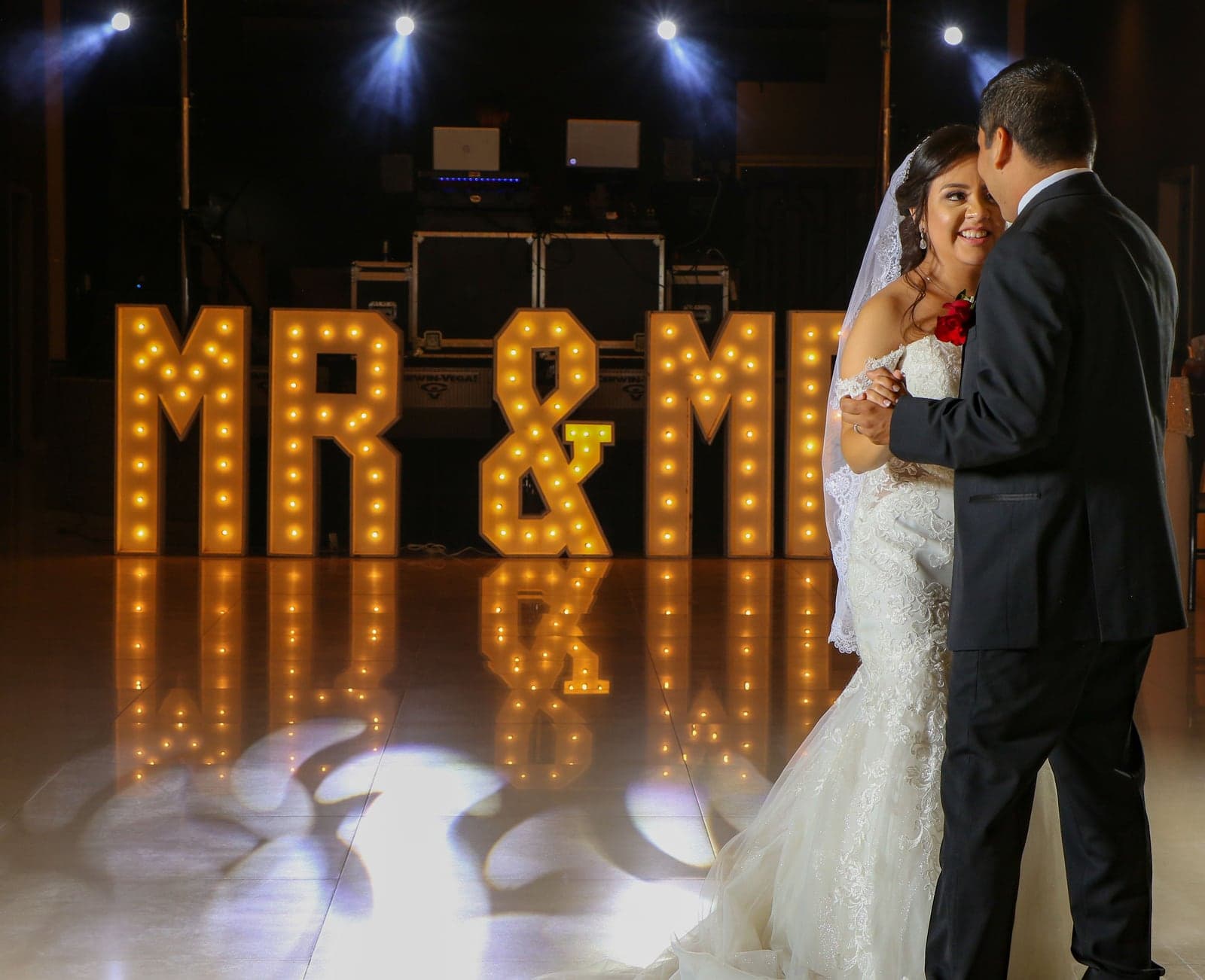 Illuminated gold MR & MRS marquee letters on the dance floor