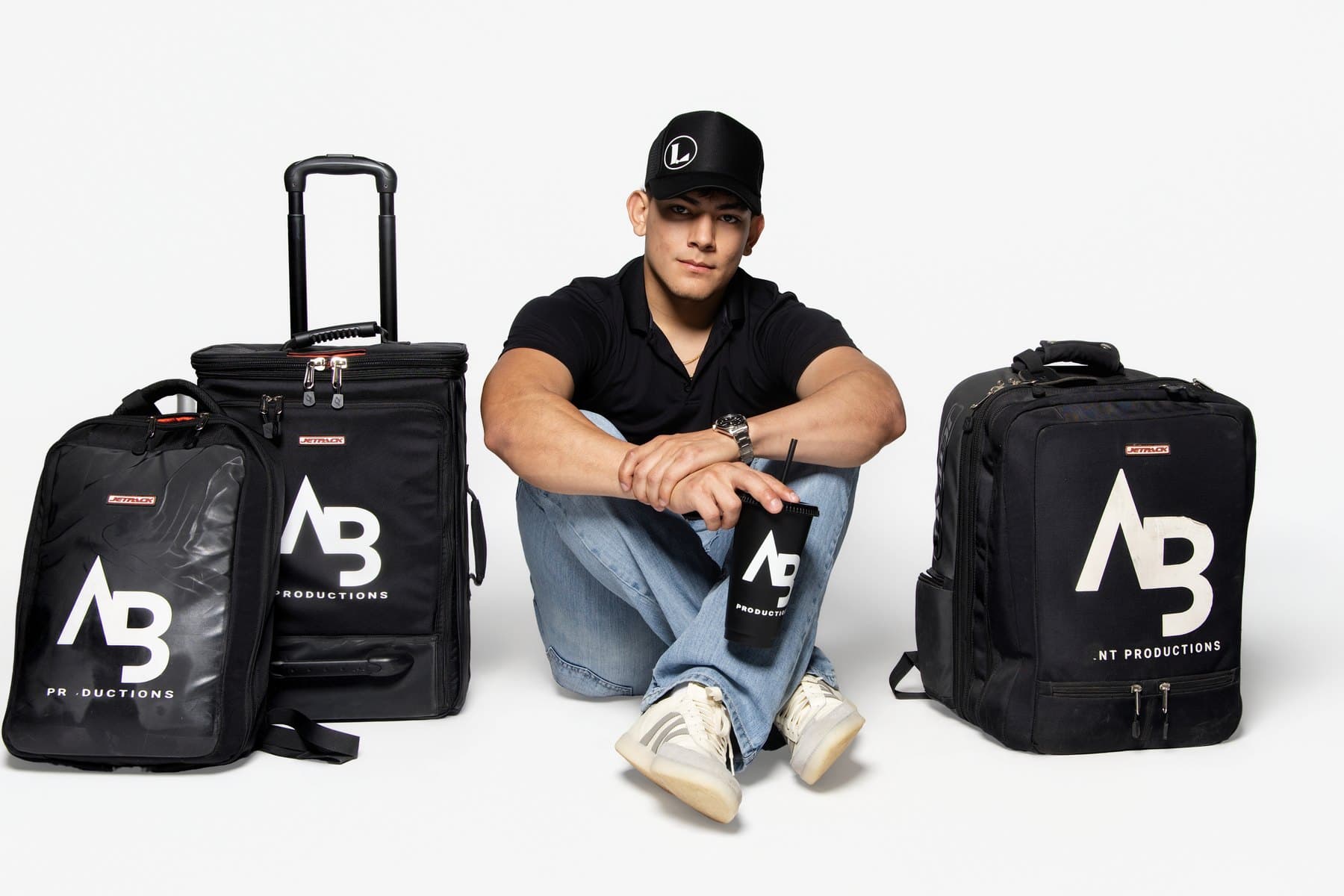 Everything in branded AB road cases — one crew, one setup, on time.