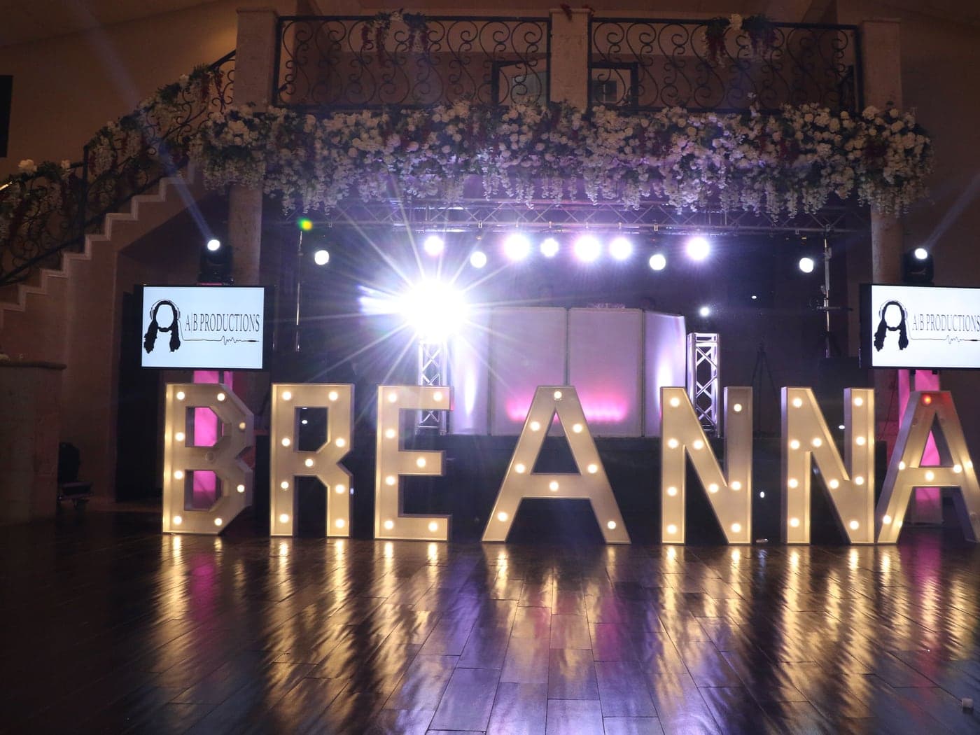 Full stage production with marquee names, uplighting and cold sparks by AB Event Productions