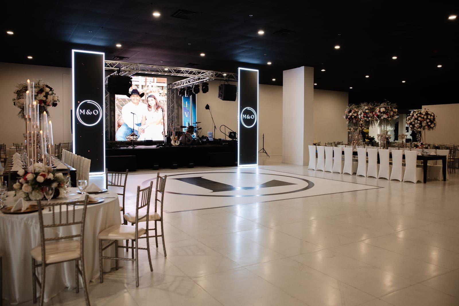 Elegant reception hall set with banquet tables at Localé by AB Events