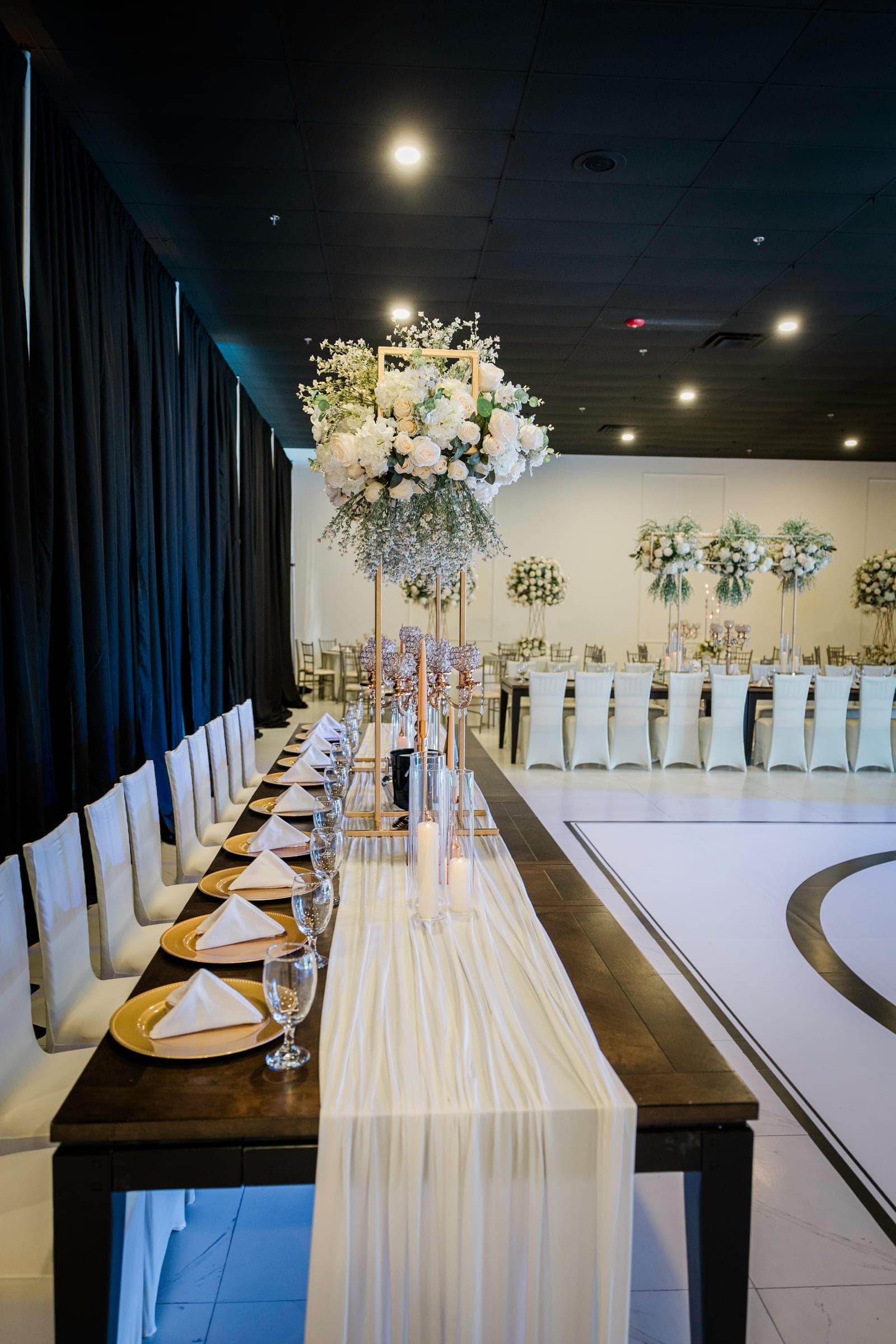 Reception area with uplighting and draping at the Localé venue in Weslaco