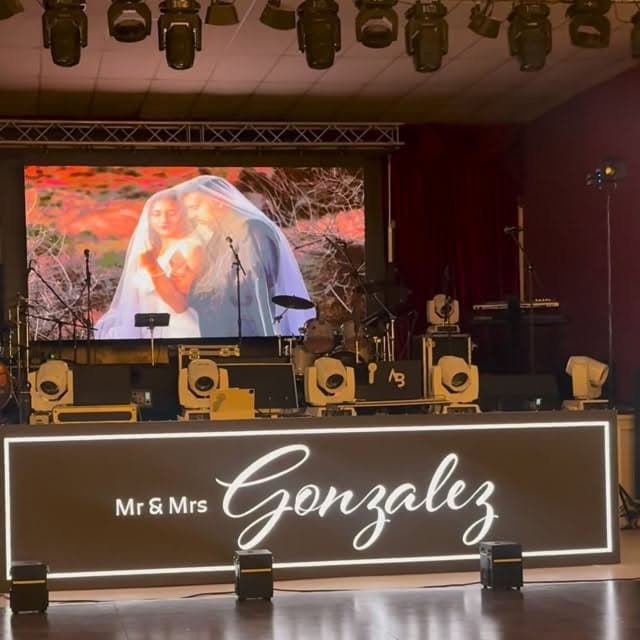 Wedding with custom neon sign, LED screen and moving-head lighting by AB Event Productions